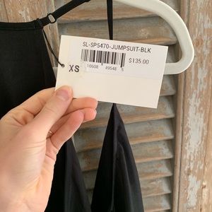 A black jumpsuit for a formal event.